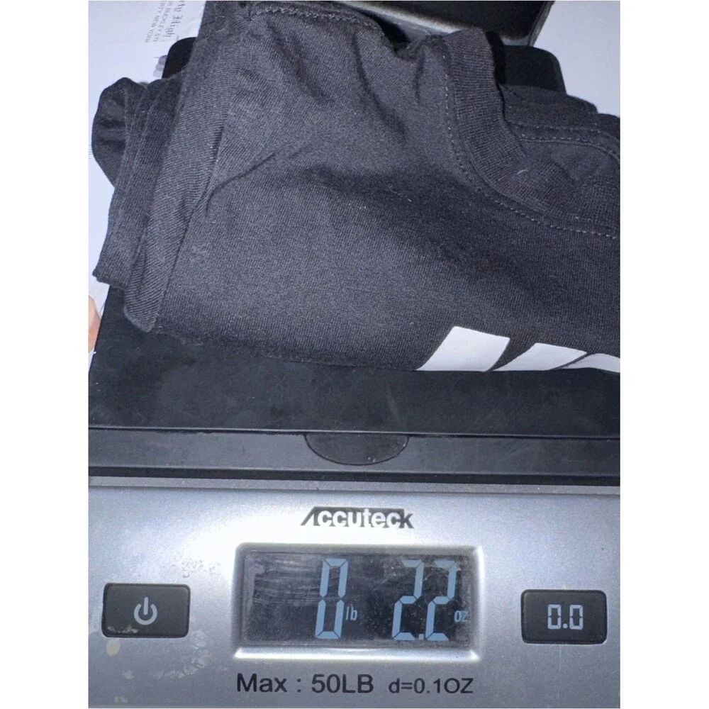 Nike size 5 Black with White Logo tee shirt